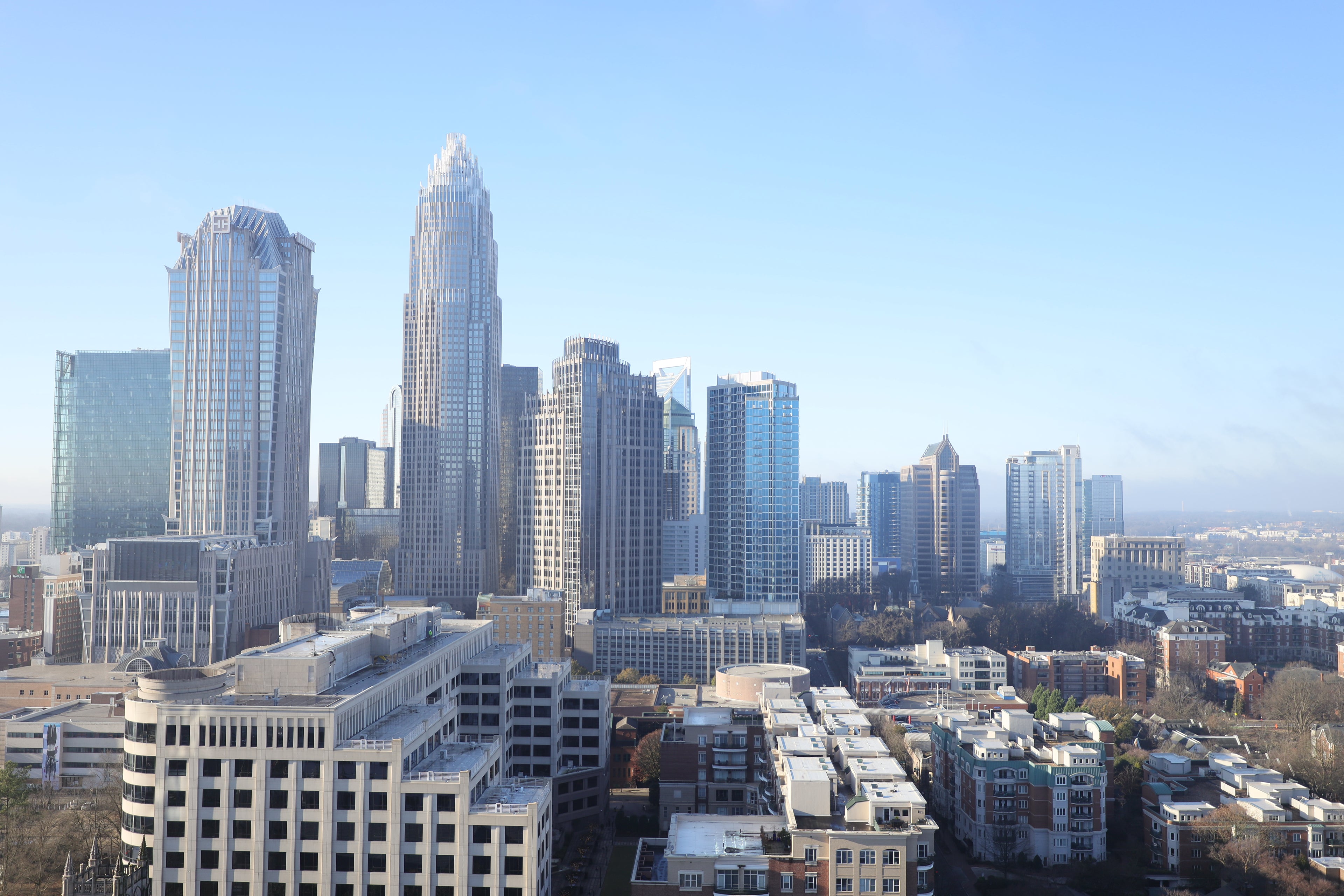 City skyline with tall buildings under a clear blue sky